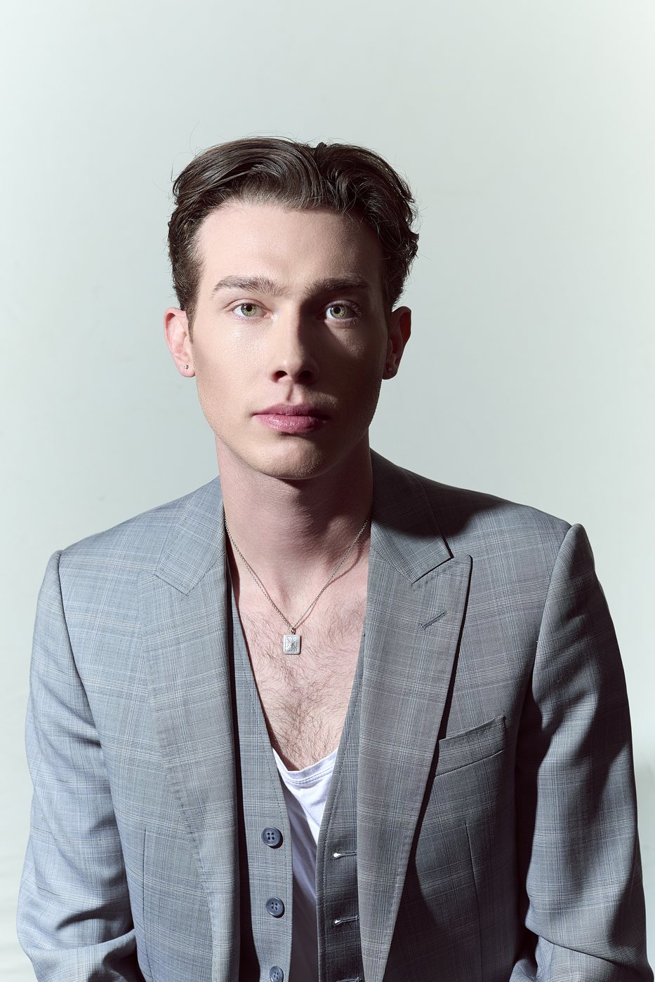 Studio model portrait in a grey blazer
