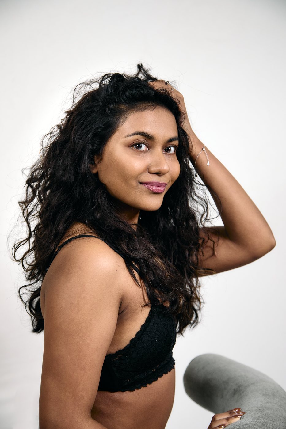 Editorial portrait with a relaxed studio pose